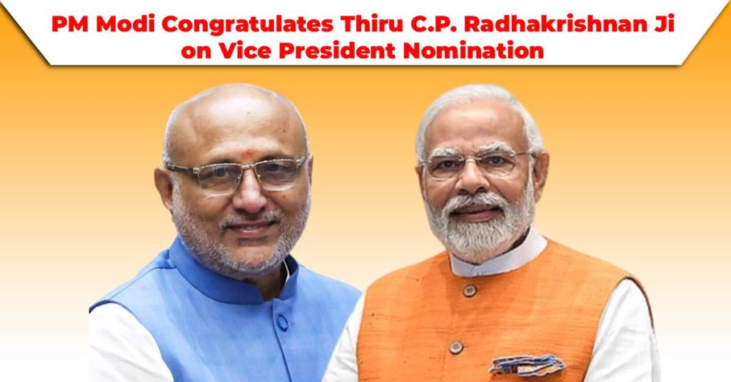 Prime Minister Narendra Modi and Thiru C.P. Radhakrishnan standing side by side, smiling at the camera. Modi is wearing an orange vest over a white kurta, while Radhakrishnan is in a blue vest over a white kurta.